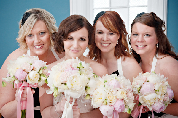 Bride and her bridesmaids holding bouquets of white, ivory, light pink, and lavender flowers - photo by Portland wedding photographer Barbie Hull 